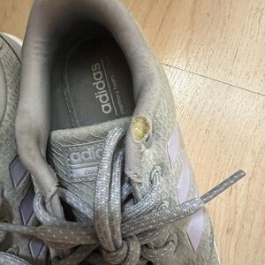 Used adidas shoes .. there is a tear on the shoe as shown in the picture